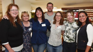 A group of friends reconnecting at a reunion