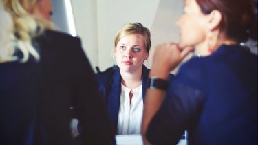Three women having a discussion