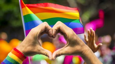 Pride logo with a heart symbol