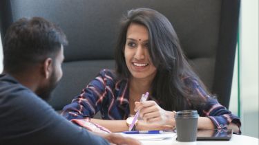 An economics student working - image
