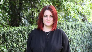 Indra With Red Hair Against Greenery
