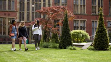 A group of students walking through Firth Court