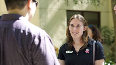 Two students outside in conversation