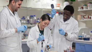 Medical students using lab equipment