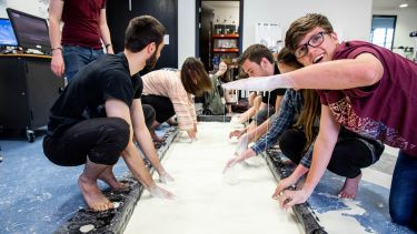 An image of students participating in the custard run