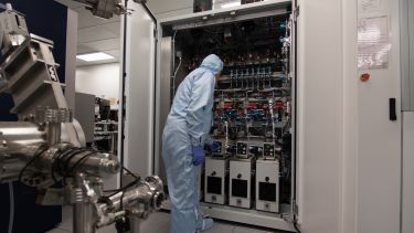 A reactor with its doors open used by the National Epitaxy Facility