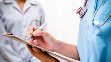 Nurse with a clipboard, close up on clipboard