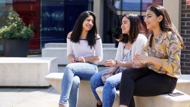 Students in the Management School courtyard
