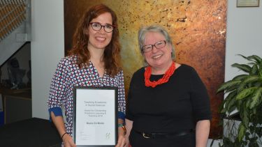 Photo of Maria Gil Molto receiving a Teaching Excellence Award