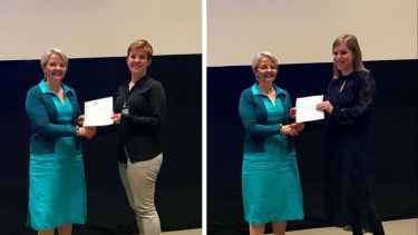 Elizabeth receiving her prize from Professor Wendy Baird and Melissa receiving her prize from Professor Wendy Baird.