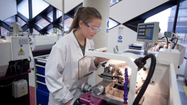 An image of a female student working in a Diamond lab.