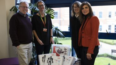 Robotics kit and staff members 