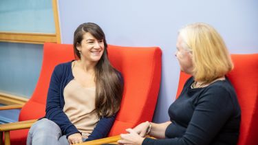 staff talking to student 