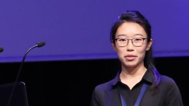 Medical School graduate Jane Jiang giving a presentation - image 