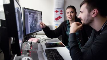 Two researchers in the Electron Microscopy Facility