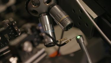 A close up of a green LED machine used by the Centre for GaN Materials and Devices