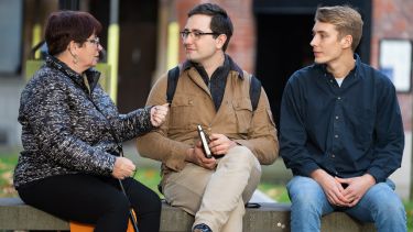Two students interview a Sheffield resident