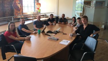 Dubit employees sat around a table