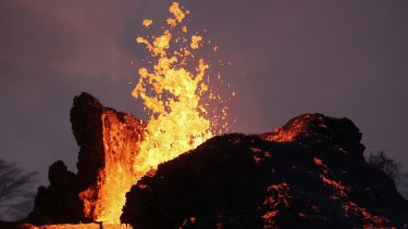 A close-up photo of an erupting volcano.