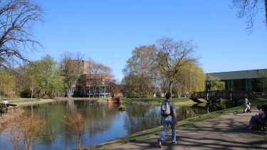 The Geography building seen from across the pond in Weston Park
