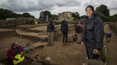 Archaeology students at a dig site.