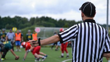 Referee on football field