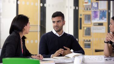 Students sat around table discussing