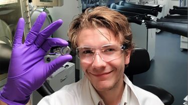 Gareth showing the results of a chemistry experiment - image 