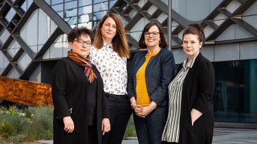 The four ladies from the Year in Industry team stand together outside The Diamond building in Sheffield.