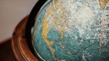 Close up image of an antique globe showing North America
