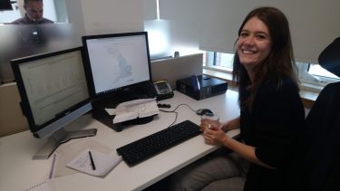 Megan sat working at her desk