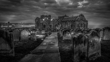 Black and white image of St Mary's Church and churchyard in Whitby