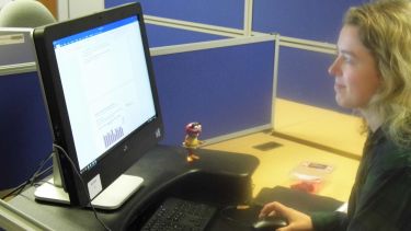 Olivia sat working at her desk
