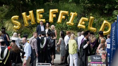 Golden balloons spell the word 'Sheffield' outside the Student's Union on graduation day.