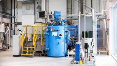 An image of a vacuum induction melting furnace in situ at the RTC