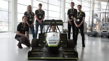 Members of the Sheffield Formula Racing Team pose by their racing car