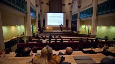 A Philosophy lecture taking place in St George's church.