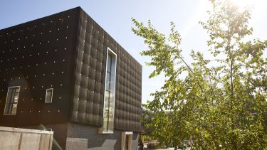A view of Soundhouse from the outside on a sunny day.
