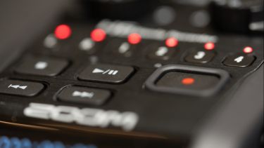 A close up of the buttons on a Zoom H6 audio recorder