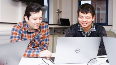 Two people smiling