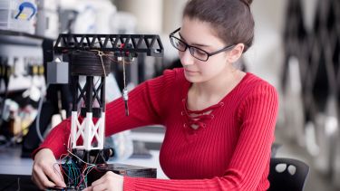 A student working with mechatronic equipment in the Control Lab in the Diamond Building