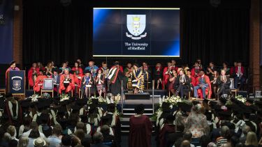 Picture of the staff procession on stage