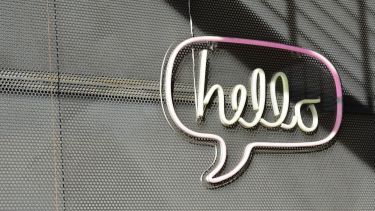 Image of a neon sign that says hello