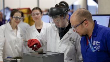 A student is working with a technical member of staff on a project - image 