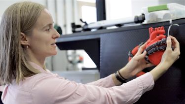 Dana working in the lab with soft robotics