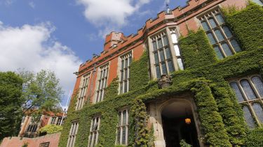 Exterior shot of Firth Court with lots of greenery.