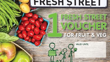 A Fresh Street voucher. It is for fruit and veg. Apples and tomatoes can be seen in the picture. 