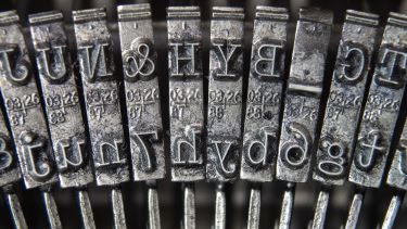 A close-up photo of printing keys on a typewriter.