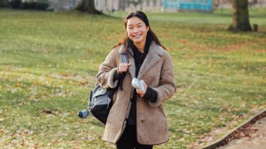 Student stands in Weston Park