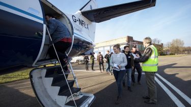 Students boarding a plane at Cranfield